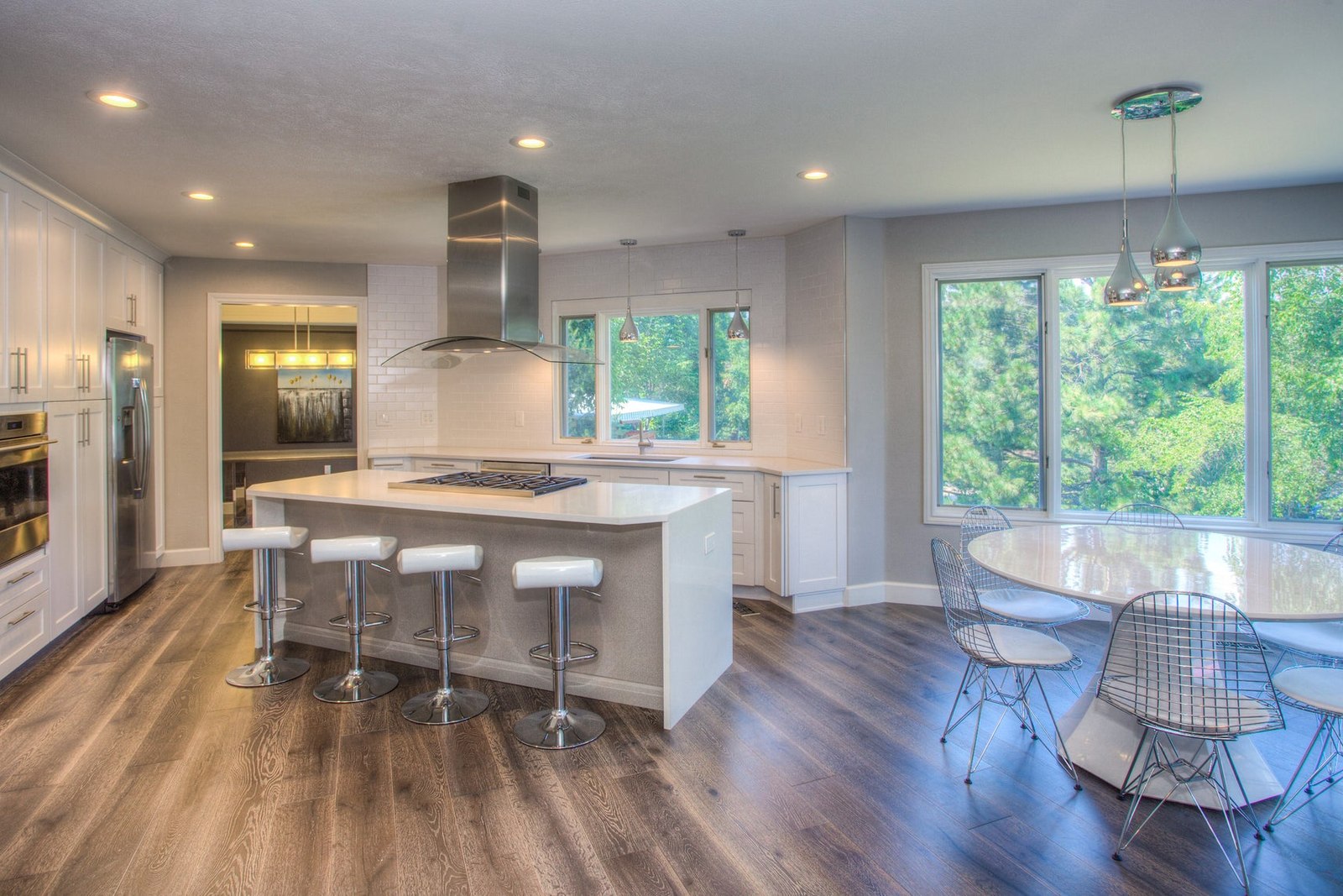 Open kitchen with a central island and space between seating and counters